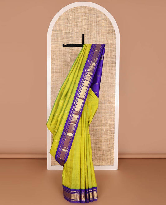 Green kancheepuram silk saree with zari buttas, contrast one-sided korvai border of panner sombu, banaras & mayil kann design & pallu of zari designs