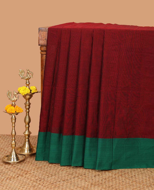 Maroon mercerised cotton saree with ganga jamuna border & cheer pallu along with striped blouse