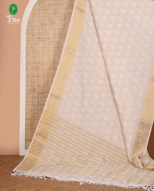 Half-white triangle motifs zari-woven viscose georgette saree,floral creeper zari border, lining seer pallu & zari design running blouse