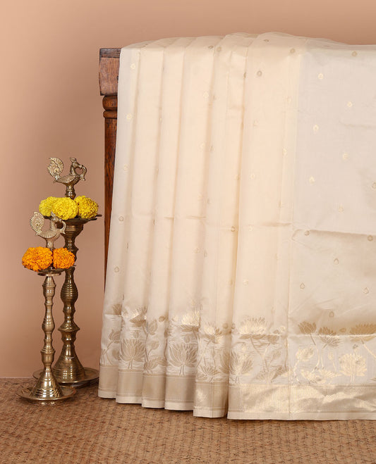 Cream zari thilakam buttas tissue silk saree, zari-woven border, pallu of pichwai lotus designs & zari design blouse