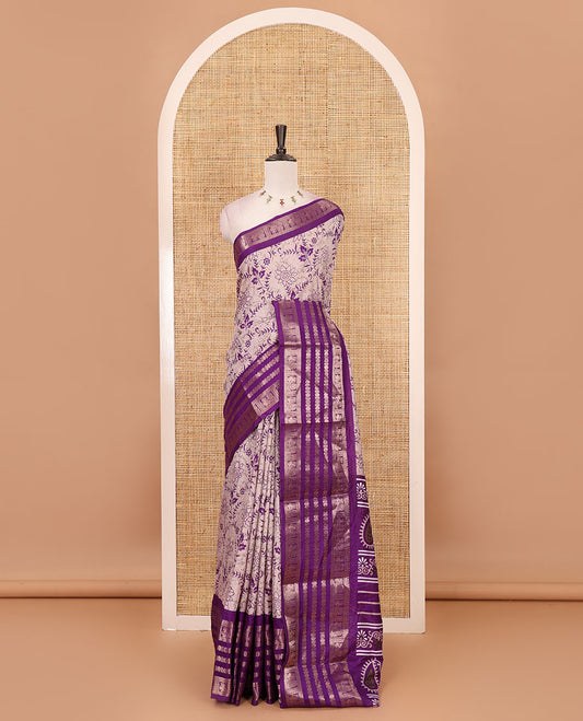 Purple floral printed dola silk saree,  contrast traditional zari rettai pettu border, pallu of paisley-floral print & contrast blouse of print & zari border