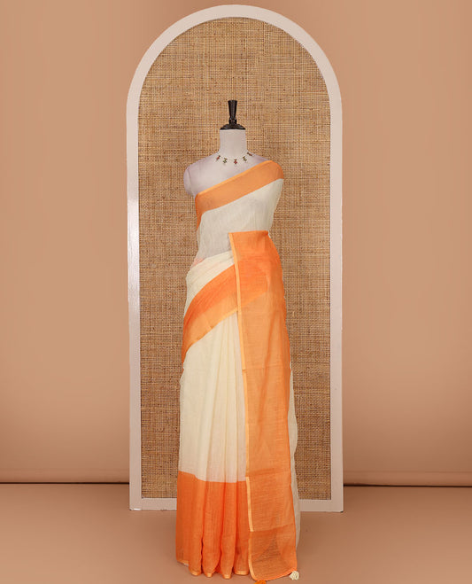 Cream full-plain linen saree, contrast orange big plain border, plain pallu & buttas printed matching blouse