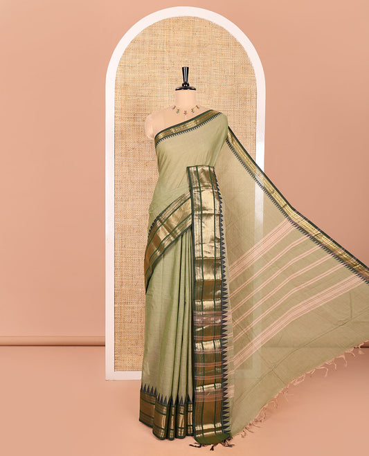 Green Plain Chettinad Cotton Saree, Complemented by Contrast Temple Border of Traditional Zari Designs, Subtly Striped Pallu, and Paired with a Matching Blouse