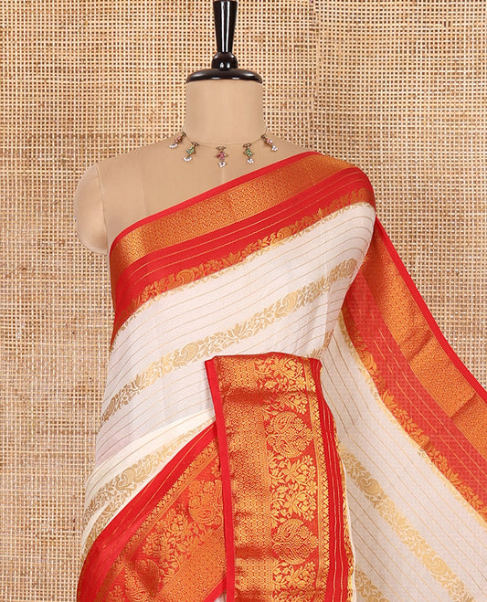White Moss Chiffon Saree, Beautified with Horizontal Stripes, Peacock, and Floral Buttas All Over Its Body, Complemented by a Contrast Traditional Zari Border, Pallu Mirrors the Same Design, and Paired with a Contrast Floral-Paisley Blouse
