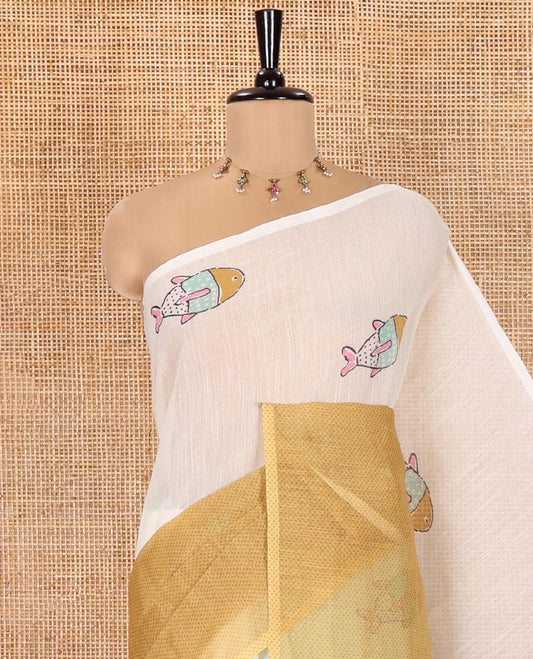 Borderless Cream and Mustard Linen Cotton Saree, Bedecked with Half-and-Half Style Fish Motifs Printed All Over Its Body, Pallu Mirrors the Same Print, and Is Paired with a Contrast Blouse