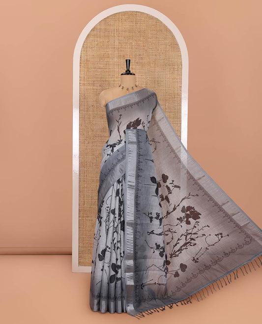 Grey Linen Cotton Saree, Detailed with Silhouette-Style Floral Motifs Printed on Its Body, Subtle Zari Bavanji Border, Pallu of Silhouette-Style Floral Print, and Comes with a Matching Blouse