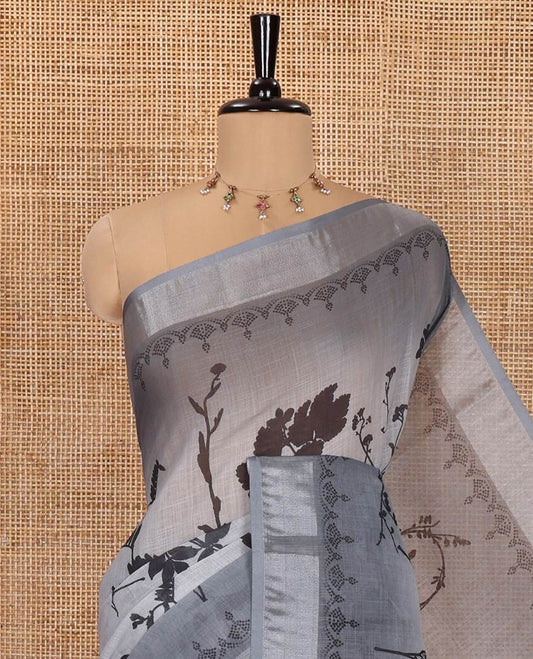 Grey Linen Cotton Saree, Detailed with Silhouette-Style Floral Motifs Printed on Its Body, Subtle Zari Bavanji Border, Pallu of Silhouette-Style Floral Print, and Comes with a Matching Blouse