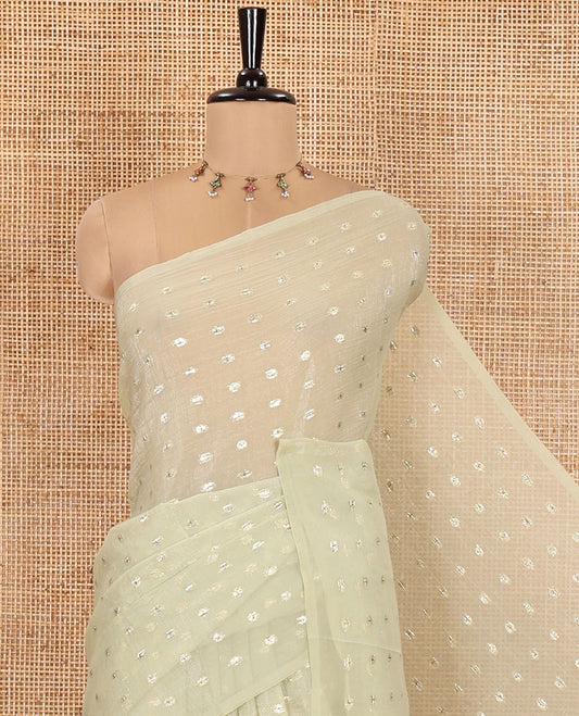 Borderless Pale Green Shimmer Saree, Detailed with Zari Buttas All Over Its Body, Pallu Mirrors the Same Buttas, and Comes Without a Blouse