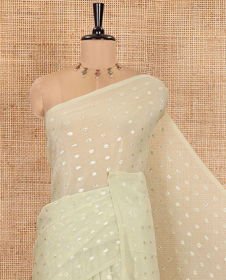 Borderless Pale Green Shimmer Saree, Detailed with Zari Buttas All Over Its Body, Pallu Mirrors the Same Buttas, and Comes Without a Blouse