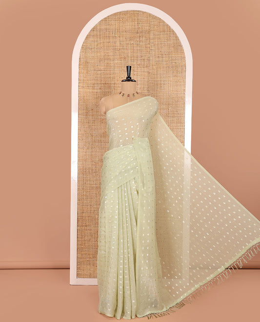 Borderless Pale Green Shimmer Saree, Detailed with Zari Buttas All Over Its Body, Pallu Mirrors the Same Buttas, and Comes Without a Blouse