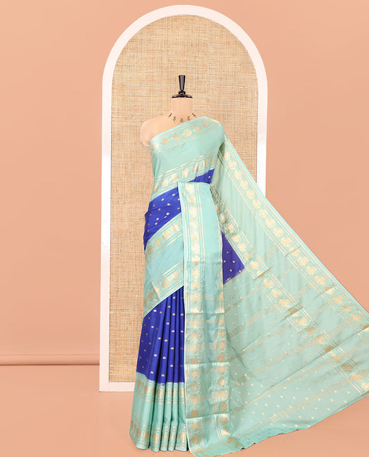Royal Blue Art Mysore Silk Saree, Enriched with Zari Buttas All Over Its Body, Complemented by a Contrast Rettai Pettu Border of Two-Headed Eagle Designs, Pallu Steeped with Buttas and Stripes, and Paired with a Contrast Blouse