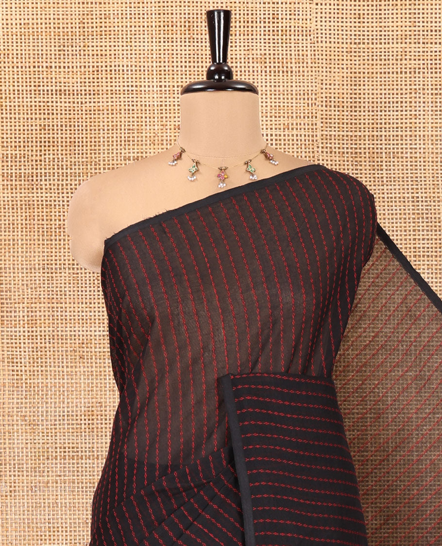 Borderless Black Chettinad Cotton Saree, Subtly Sparkled with Thread Stripes on Its Body, a Subtly Striped Pallu, and Has No Blouse