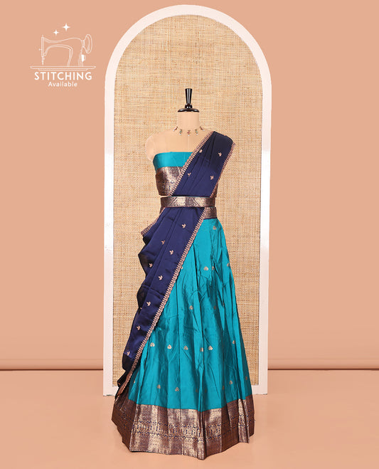 Rama and Navy Blue Semi-Banarasi Half-Saree, Mesmerized with Zari Buttas on Its Skirt, Complemented by a Contrast Traditional Zari Design Woven Border, Paired with a Matching Blouse, and a Contrast Satin Georgette Embroidered Scallop Dhavani