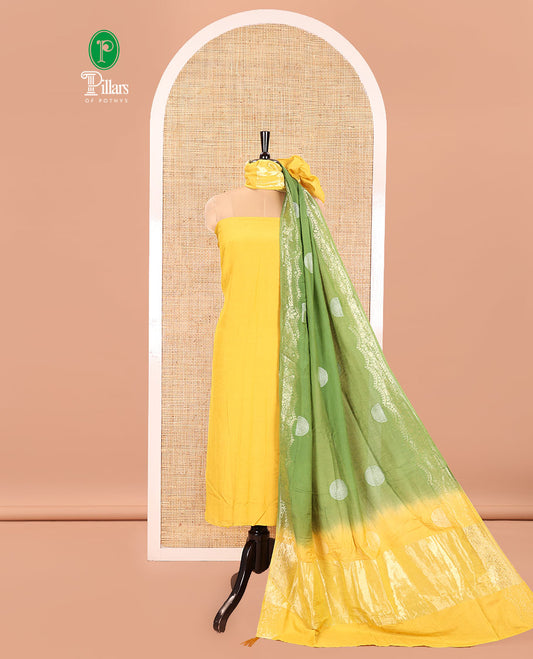 Yellow Semi Silk Material Churidar Set, Subtly Made Plain Top, a Plain Santoon Bottom, and Is Paired with a Dual-Colored Bandhani Motifs Semi Silk Dupatta