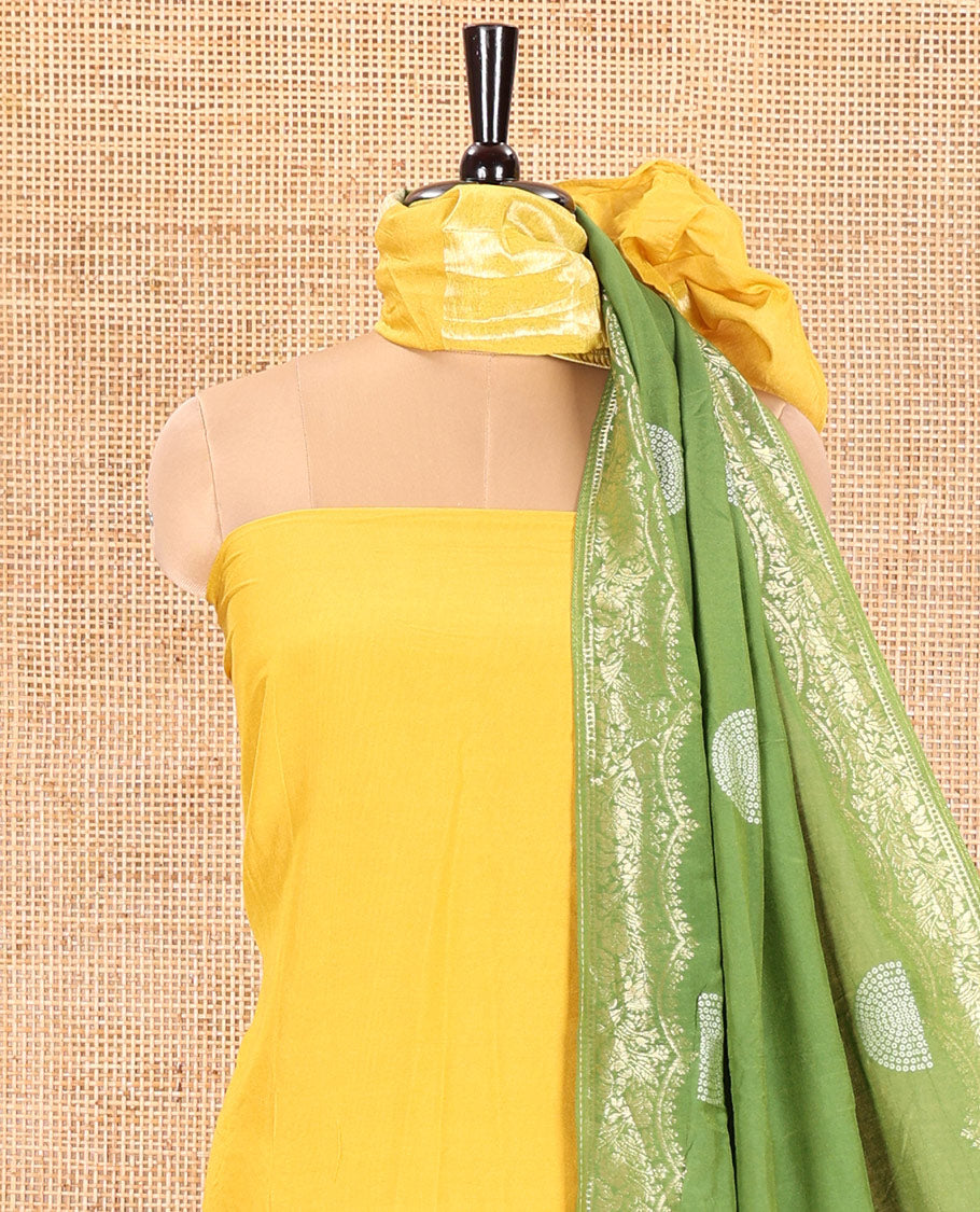 Yellow Semi Silk Material Churidar Set, Subtly Made Plain Top, a Plain Santoon Bottom, and Is Paired with a Dual-Colored Bandhani Motifs Semi Silk Dupatta