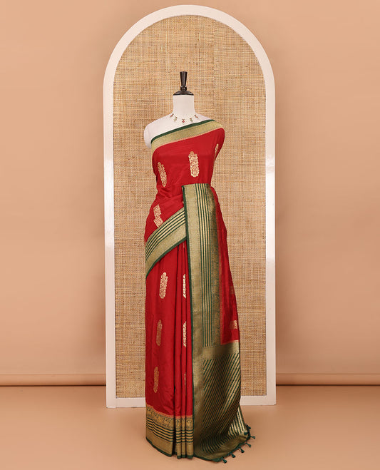 Maroon floral zari buttas dola silk saree, contrast traditional zari peacock border, diagonal floral zari striped pallu & contrast jacquard blouse