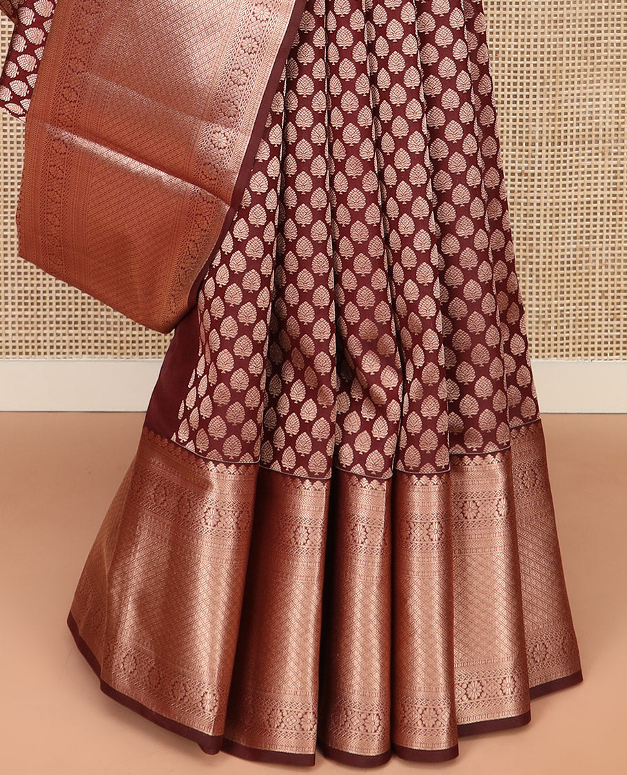 Brown Kanchipuram Silk Saree Enlivened with Zari Buttas, Complemented by Zari Border of Kathir, Neli, Kamalam, Chakram,  Manga, and Mayil Kann Designs, Pallu Decked Up with Mayil Kann Designs, and Paired with a Matching Blouse