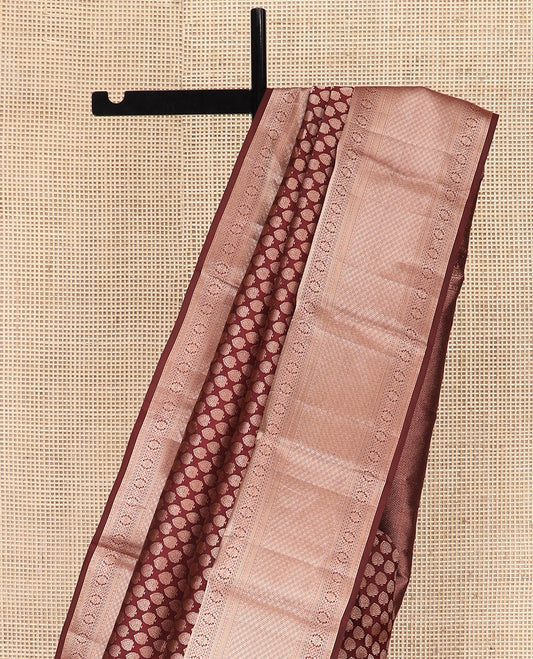Brown Kanchipuram Silk Saree Enlivened with Zari Buttas, Complemented by Zari Border of Kathir, Neli, Kamalam, Chakram,  Manga, and Mayil Kann Designs, Pallu Decked Up with Mayil Kann Designs, and Paired with a Matching Blouse