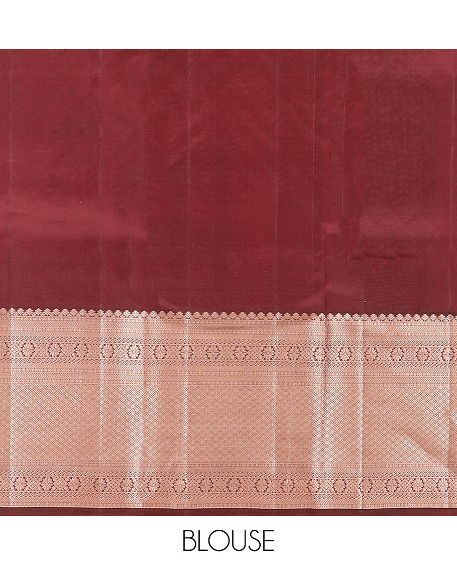 Brown Kanchipuram Silk Saree Enlivened with Zari Buttas, Complemented by Zari Border of Kathir, Neli, Kamalam, Chakram,  Manga, and Mayil Kann Designs, Pallu Decked Up with Mayil Kann Designs, and Paired with a Matching Blouse