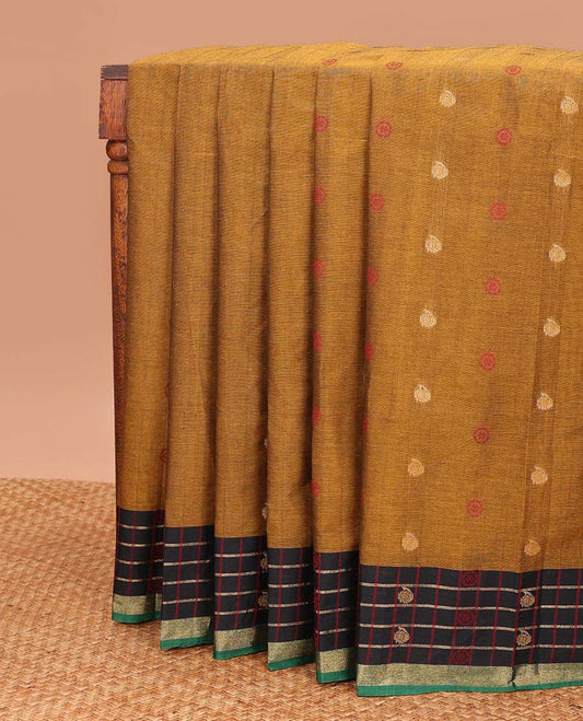 Mustard chakra, and paisley buttas Coimbatore cotton saree, contrast butta enclosed checked border, and pallu of paisleys and chevron design