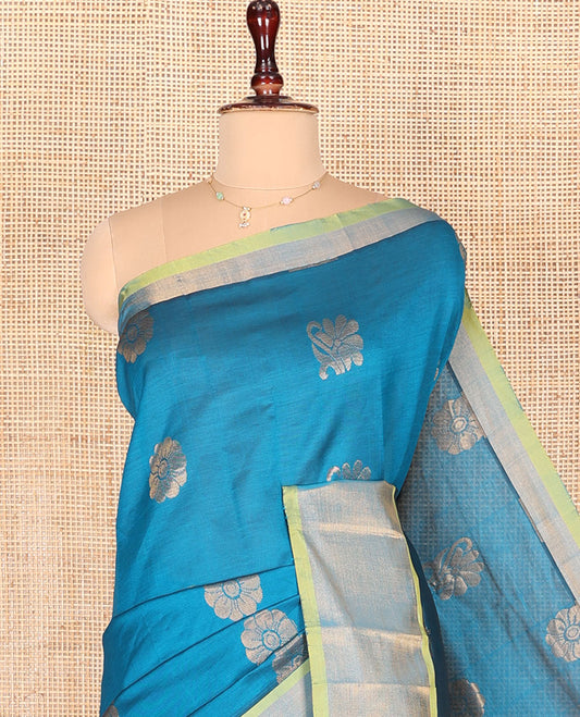 Blue Kuppadam Cotton Saree, Beautified with Zari Buttas on Its Body, Highlighted  by Bavanji Zari Border, Complemented by Contrast Ogee Patterned Pallu, and Paired with a Contrast Blouse