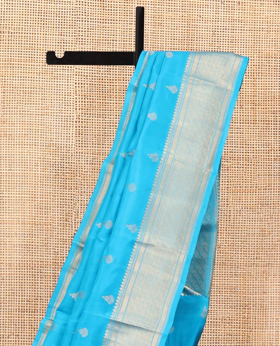 Blue Vasundhara Lite Silk Mix Saree, Adorned with Zari Buttas All Over Its Body, Highlighted by Zari Border of Thilakam Mokku, and Kodi Visiry Designs, Grand Jaal Pallu, and Paired with a Matching Blouse