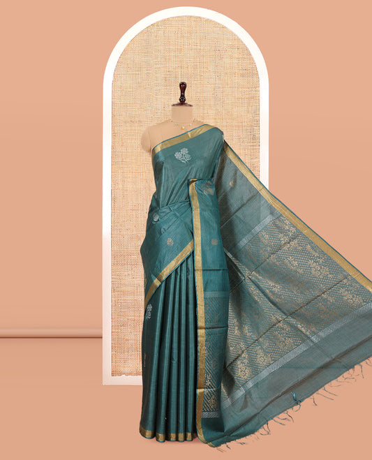 Green Tussar Saree, Showcasing Floral Buttas, a Subtle Zari Border, Pallu of Polka Dot and Floral Designs, and a Matching Blouse