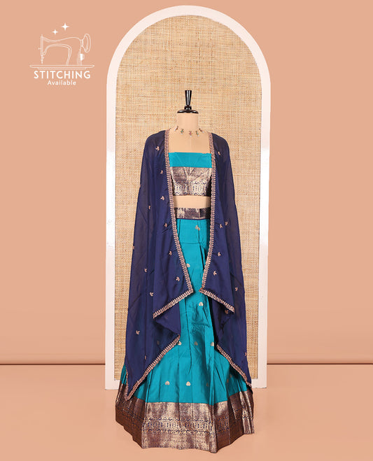 Rama and Navy Blue Semi-Banarasi Half-Saree, Mesmerized with Zari Buttas on Its Skirt, Complemented by a Contrast Traditional Zari Design Woven Border, Paired with a Matching Blouse, and a Contrast Satin Georgette Embroidered Scallop Dhavani