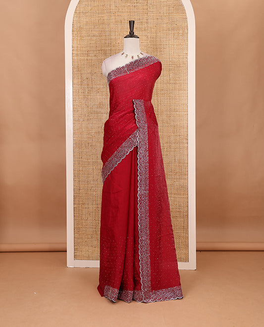 Maroon Swarovski crystal stone embedded fendy chiffon saree, scallop Swarovski stone embroidered border, and contrast plain blouse