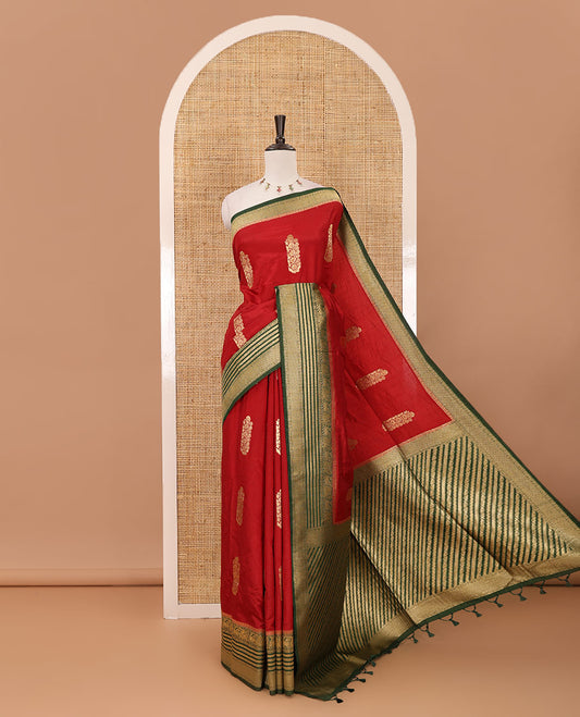 Maroon floral zari buttas dola silk saree, contrast traditional zari peacock border, diagonal floral zari striped pallu & contrast jacquard blouse