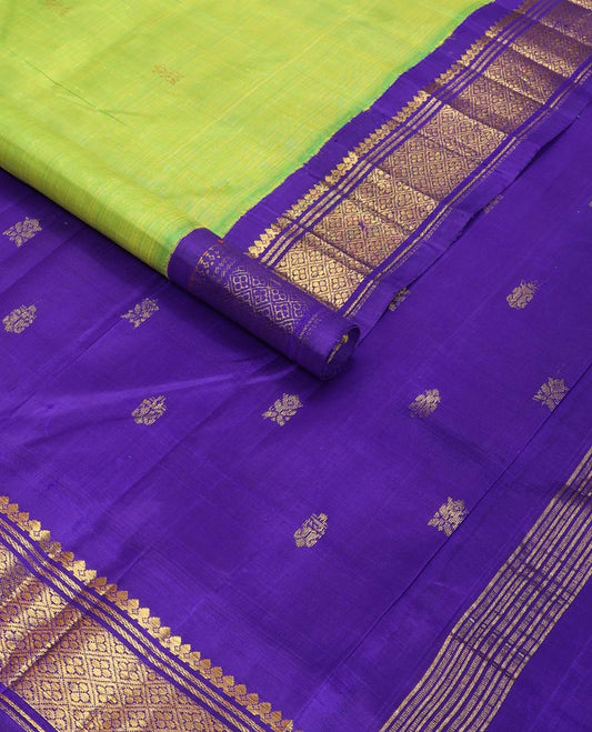 Light green buttas kancheepuram silk saree with contrast korvai border of thilakam mokku, banaras design & zari design pallu