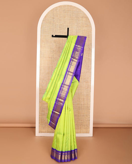 Light green buttas kancheepuram silk saree with contrast korvai border of thilakam mokku, banaras design & zari design pallu