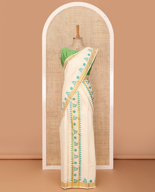 Cream base golden vertically striped with flower and Krishna motifs printed Kerala Mundu set, zari border