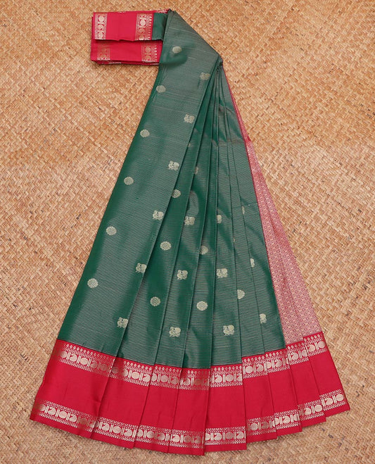 Green Budget Silk Saree, Enriched with Peacock and Chakram Buttas All Over Its Body, Complemented by Contrast Traditional Zari Designs Woven Rettai Pettu Border, Grand Jaal Pallu and Paired with a Contrast Blouse