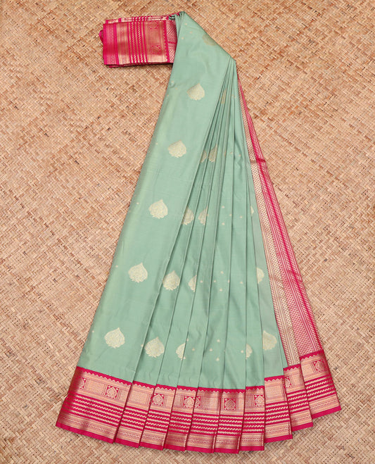 Green Budget Silk Saree, Sparsely Woven with Buttas All Over Its Body, Complemented by a Contrast Traditional Zari Design Border, a Grand Pallu of Geometric Design, and Paired with a Contrast Blouse