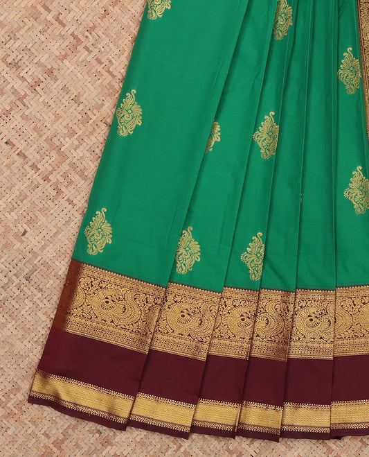 Green Budget Silk Saree, Detailed with Zari Buttas, Complemented by Contrast Traditional Rettai Pettu Border, a Jaal Pallu and a Contrast Blouse