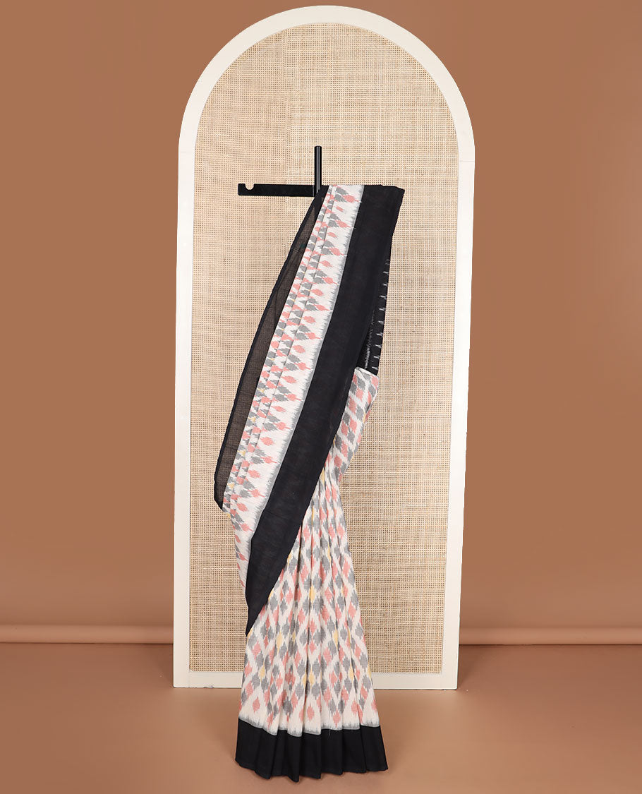Cream-base multi-color jaal-patterned ikkat cotton saree, contrast plain border & chevron striped pallu