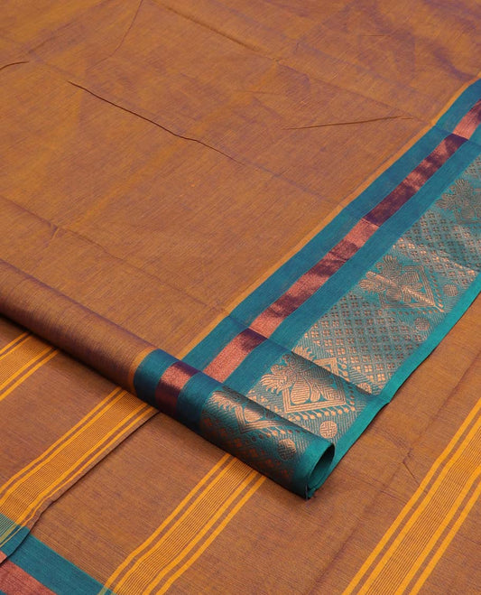 Mustard plain nine-yard cotton saree, contrast traditional zari border, and striped pallu