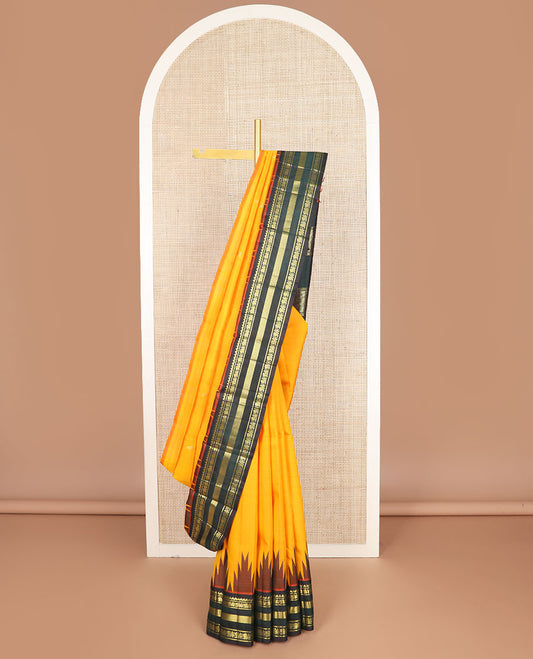 Orange zari buttas kanchipuram silksaree, contrast one-sided thazampoo rekku border of salngai,banaras,mayil & vanki & zari design pallu