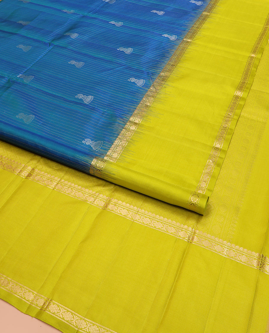 Blue Kanchipuram Silk Saree, Sparsely Sparkled with Muthu Stripes and Jhumka Buttas All Over Its Body, Complemented by a Contrast Rettai Pettu Border of Thilakam Mokku, and Laddu Kamalam Designs, Subtly Sparkled Pallu, and Paired with a Contrast Blouse