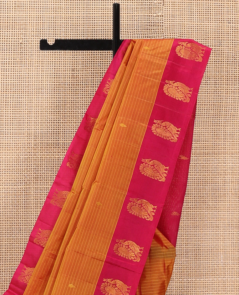 Orange Kanchipuram Silk Saree Prettified with Vazhaipoo Stripes and Zari Buttas, Complemented by Contrast Border Featuring Mayil Motifs, Sparsely Zari Woven Pallu, and Paired with a Contrast Blouse