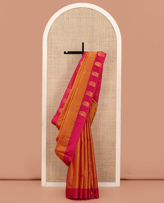 Orange Kanchipuram Silk Saree Prettified with Vazhaipoo Stripes and Zari Buttas, Complemented by Contrast Border Featuring Mayil Motifs, Sparsely Zari Woven Pallu, and Paired with a Contrast Blouse