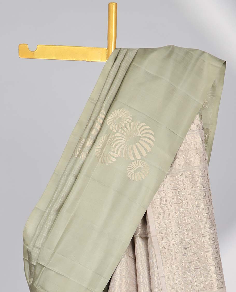 Borderless green buttas soft silk saree with intricate zari design pallu