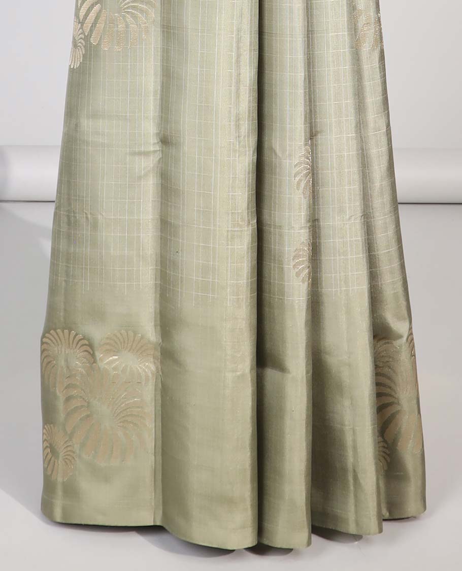 Borderless green buttas soft silk saree with intricate zari design pallu