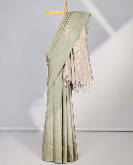 Borderless green buttas soft silk saree with intricate zari design pallu