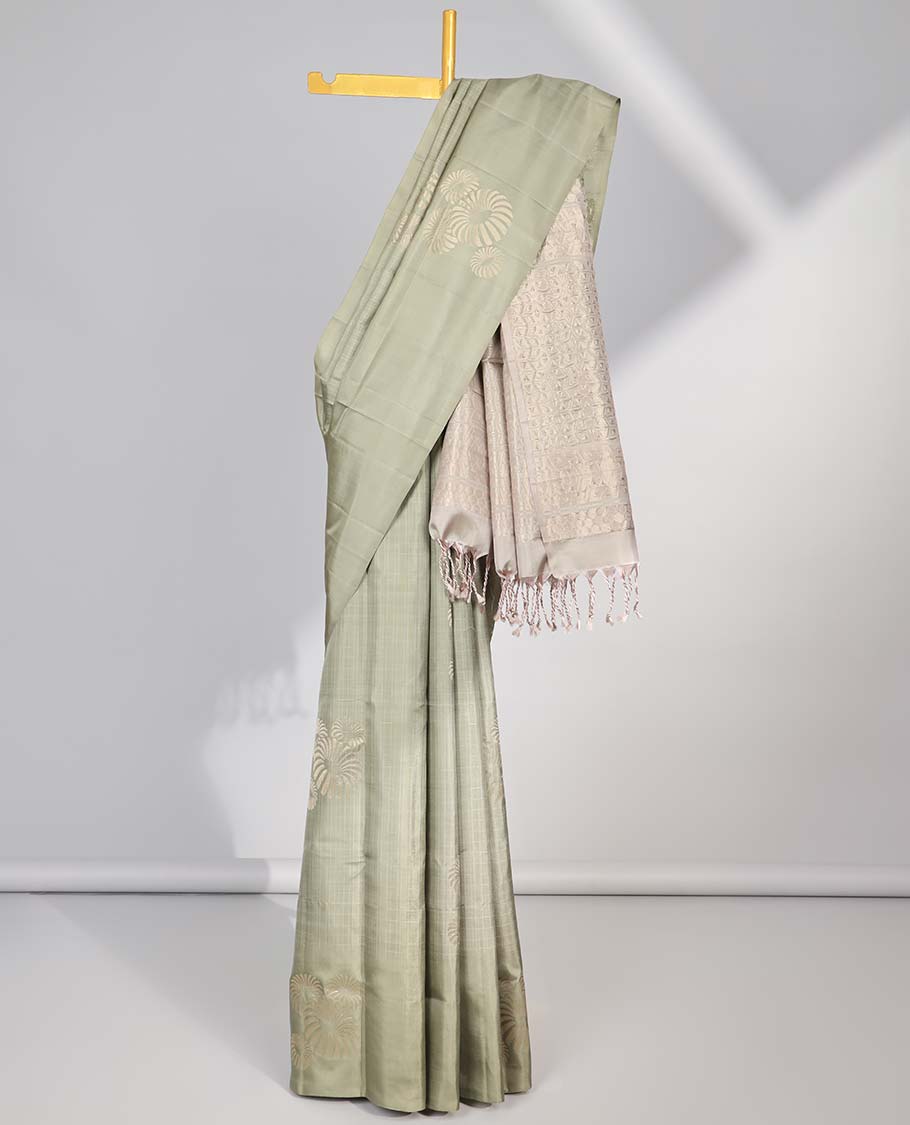 Borderless green buttas soft silk saree with intricate zari design pallu