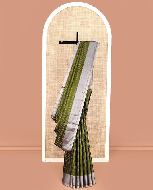 Green Mayuri Soft Silk Saree, Steeped with Buttas All Over Its Body, Complemented by Contrast Border, Pallu of Chevron Stripes, and Paired with a Contrast Blouse