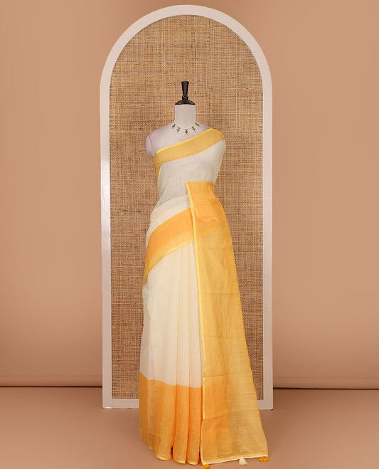 Cream full-plain linen saree, contrast yellow big plain border, plain pallu & buttas printed matching blouse