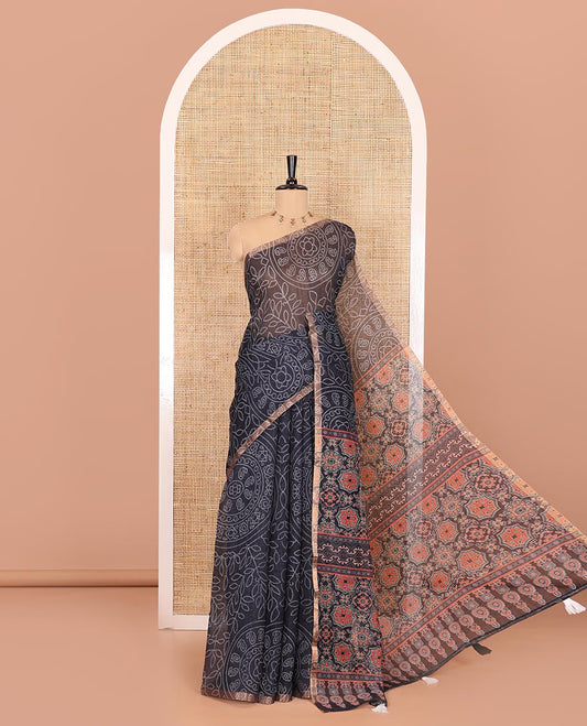 Black bandhani-style floral and chakra printed saree, zari piping border, contrast ajrakh printed pallu, and contrast ajrakh printed blouse