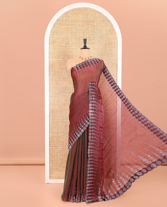 Wine Fendi Chiffon Saree Sparkled With Glittering Swarovski Stones Struck All Over Its Body, Complemented With Scallop Swarovski Stone Work Border, Swarovski Stone Work Pallu, And A Matching Swarovski Stone Work Blouse